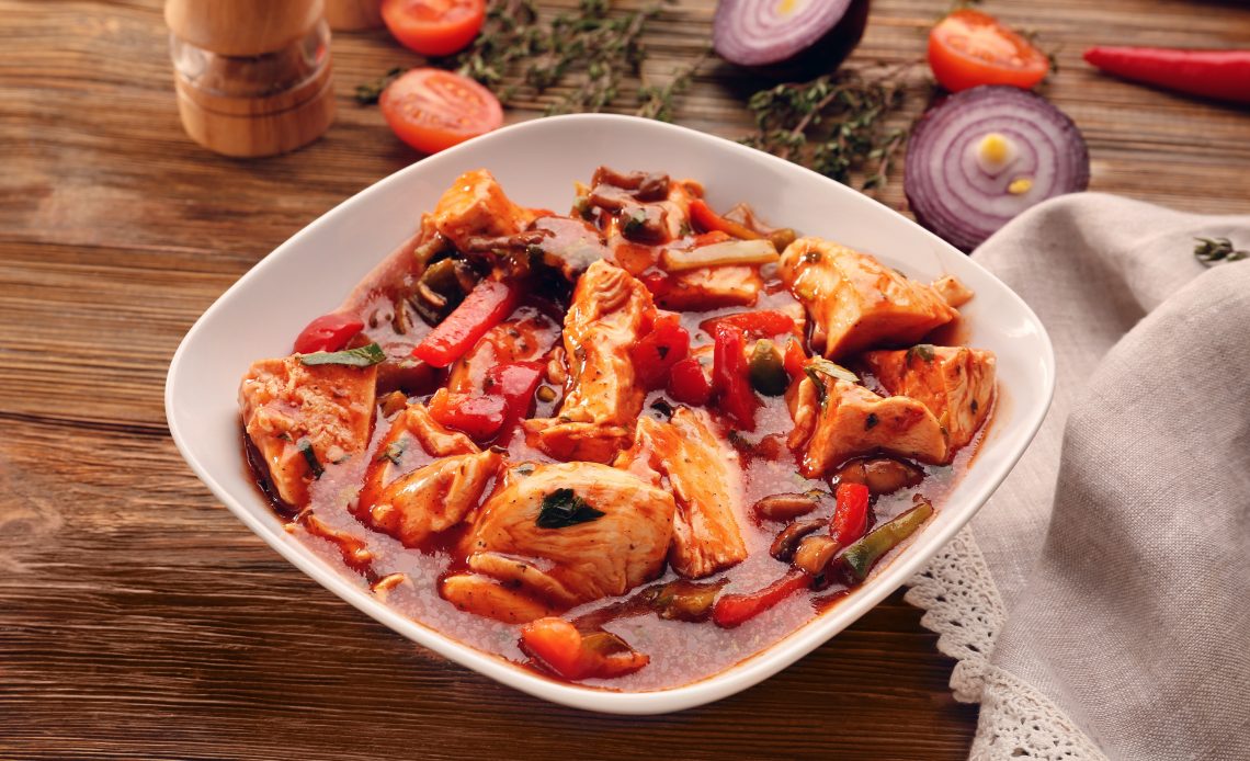 plate-with-chicken-cacciatore-on-kitchen-table